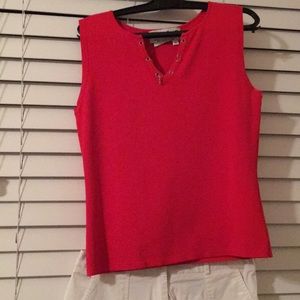 Red shirt with white cropped pants